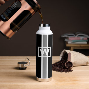 Initiaal van wolmonogrammen gestript met moderne k waterfles