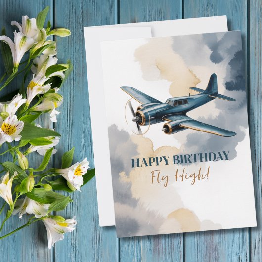 Invitation Avion d'anniversaire bleu et or aquarelle élégante