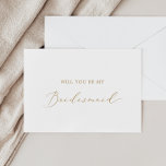 Invitation Delicate Gold Calligraphy Bridesmaid Proposal Card<br><div class="desc">This delicate gold calligraphy bridesmaid proposal card is perfect for a modern wedding. The romantic minimalist design features lovely and elegant champagne golden yellow typography on a white background with a clean and simple look. Customize the card with the name of the bride and the bridesmaid. Personalize the back of...</div>