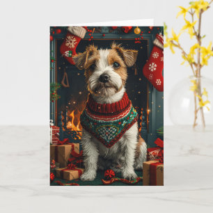 Jack Russell-hond met kerstcadeaus bij de open haa Kaart