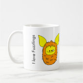 J'aime Fuzzling orange/jaune de tasse de Fuzzlings (Gauche)