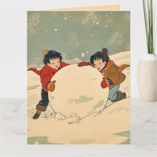 Japanse kinderen rollen een grote sneeuwbal kaart