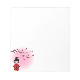 Japanse kokeshi-pop bij sakura blossom notitieblok