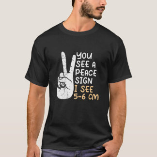 Je ziet een Vredesbord. Ik zie 5 6 cm vroedvrouw 1 T-shirt