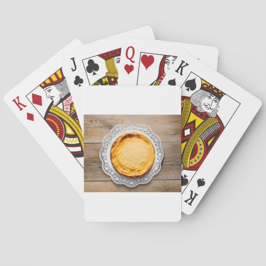Jeu De Cartes Cheesecake on rustic wood cake top. (dos)