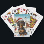 Jeu De Cartes Dachshund Winter Wonderland Christmas Joy<br><div class="desc">Ce design festif reflète l'esprit joyeux de la période des fêtes, avec un adorable petit portant un chapeau de Père Noël. Le chien est niché dans un pays des merveilles hivernales, avec un bonhomme de neige, un sapin de Noël décoré et des cadeaux joliment emballés. Les flocons de neige tombent...</div>