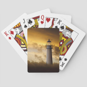 Jeu De Cartes Phare rougeoyant sous le ciel dramatique