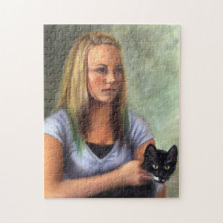 Jeune fille avec le puzzle de chat noir