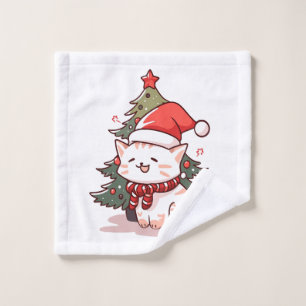Joli chat portant un chapeau de Père Noël près de