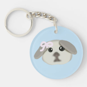 Joli chiot avec porte-clés ruban rose