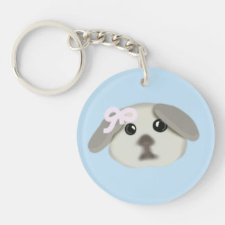Joli chiot avec porte-clés ruban rose