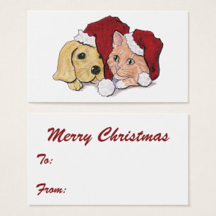 Joli chiot Labrador de Noël et chat tigré orange
