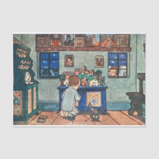 jongen die met kerstspeelgoed speelt tissuepapier