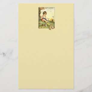 Jongen leest onder boom met konijnen briefpapier