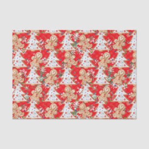 Jongen, meisje met kerstboom op rood tissuepapier