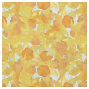 Jonquilles jaune-orange sur le tissu floral vert