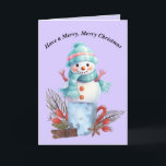 Joyeuse carte Snowman de Noël<br><div class="desc">Joyeuse carte Snowman de Noël. Le Snowman est assis sur une tasse avec des décorations de Noël,  et la carte est principalement bleu et violet clair. Les mots à l'intérieur peuvent être changés. Merci à Creative Fabrica pour certains des éléments du design.</div>