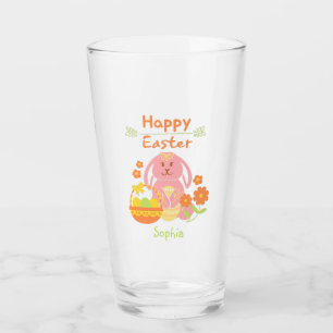 Joyeux lapin rose de Pâques et verre de fleurs