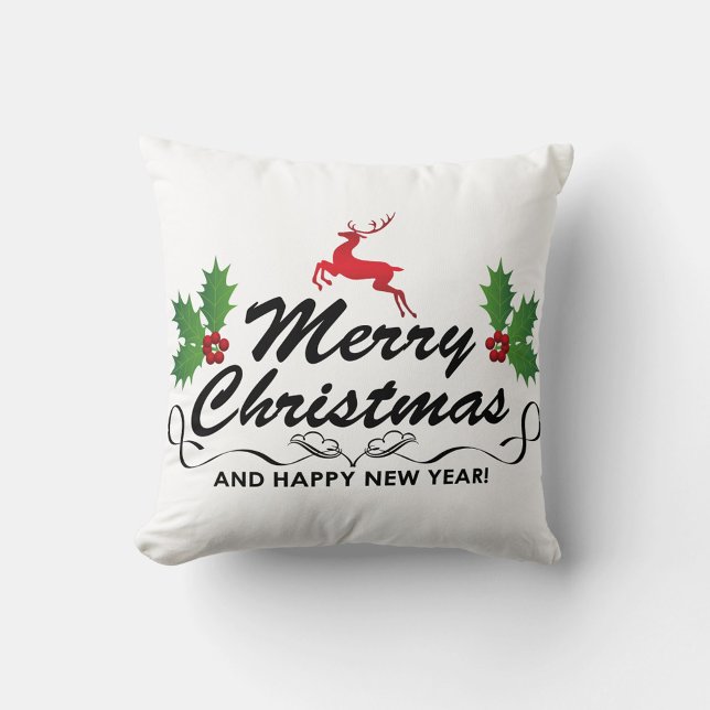 Joyeux Oreiller de Noël (A throw pillow with the words "Merry Christmas" in a decorative black font, with a red reindeer.)