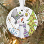 Joyeux Snowman<br><div class="desc">Cet ornement de Noël en acrylique présente un heureux bonhomme de neige qui regarde un ornement d'arbre de Noël.</div>