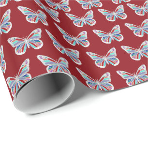 Juweelvlinders op bordeauxrood cadeaupapier