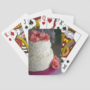 Kaarten afspelen met roze en witte cake op de acht