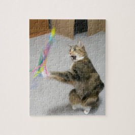 Kat valt het teaser speelgoed puzzel aan