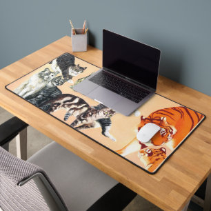 Katten aan het spelen bureaumat