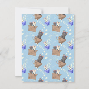 Katten in doos en melkdruppels op blauw feestdagenkaart