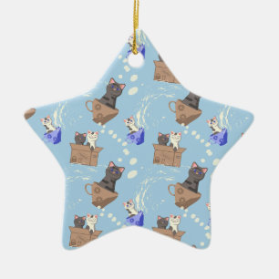 Katten in doos en melkdruppels op blauw keramisch ornament