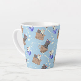 Katten in doos en melkdruppels op blauw latte mok