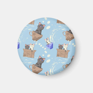 Katten in doos en melkdruppels op blauw magneet