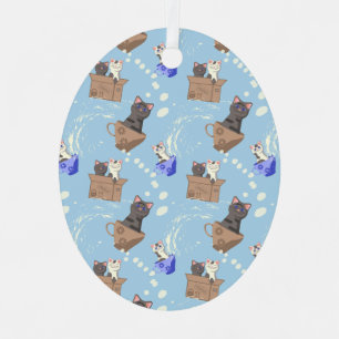 Katten in doos en melkdruppels op blauw metalen ornament