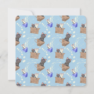 Katten in doos en melkdruppels op blauw notitiekaartje