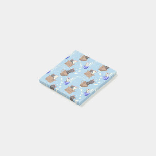 Katten in doos en melkdruppels op blauw post-it® notes