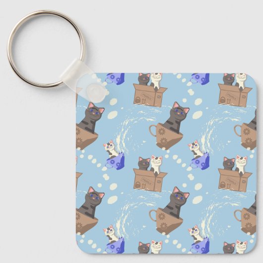 Katten in doos en melkdruppels op blauw sleutelhanger (Voorkant)