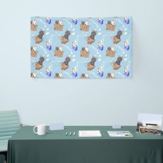 Katten in doos en melkdruppels op blauw spandoek (Beurs)
