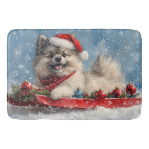 Keeshond-hond in slee Laat het sneeuwen Kerstmis Badmat