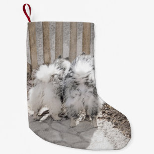Keeshonds bij het schilderen van de poort - Oorspr Kleine Kerstsok