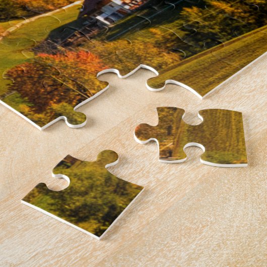 Kerk en dorp met berglandschap legpuzzel (Zijkant)