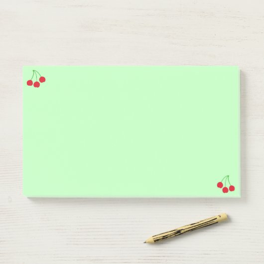 Kersen op groene Post-it® notes (Op bureau)
