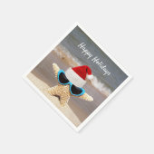 Kerst pet op tropische zeester op het strand servetten (Hoek)