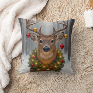 Kerstbok met een gloeiende krans kussen