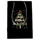 Kerstboom met konijn, bedekt door vlieglicht medium cadeauzakje (Voorkant)