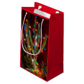 Kerstcactus met gloeiende lampjes met rode tas klein cadeauzakje (Achterkant Gekanteld)