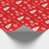 Kerstgenoom, sneeuwvlokken en baren op rood cadeaupapier (Hoek)