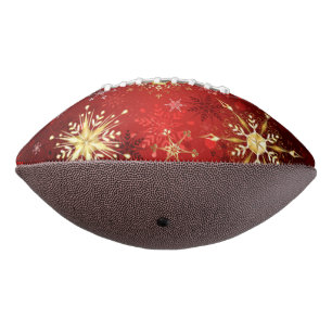 Kerstgouden sneeuwvlokken op rode achtergrond american football