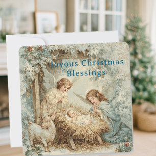 Kerstkaart met baby Jezus in een kribbe en engel