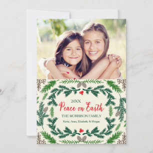 Kerstkaart met dennentakken en vredesboodschap