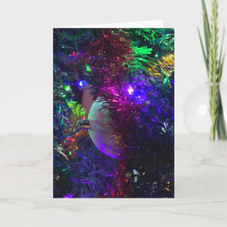 Kerstkaart met ornament en gekleurde lichten kaart